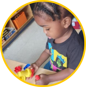 before-after-care-program-little-girl-playing-with-blocks before-after-care-program-little-girl-playing-with-blocks